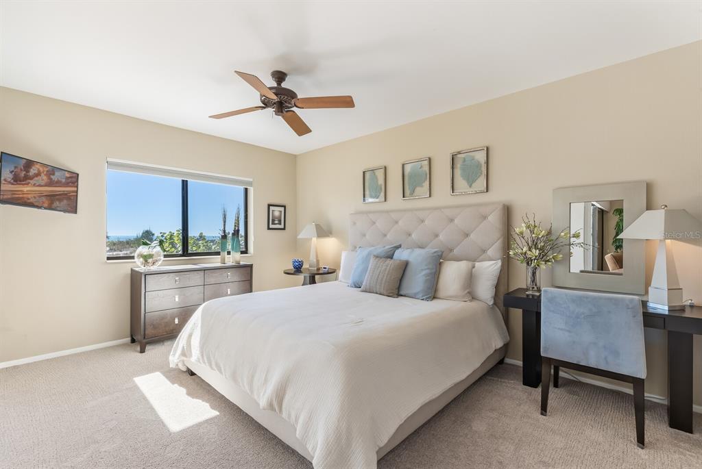 5000 Gasparilla Road, Unit 53A Boca Grande, FL 33921 - Photo 14 of 55 a bedroom with a bed and a desk