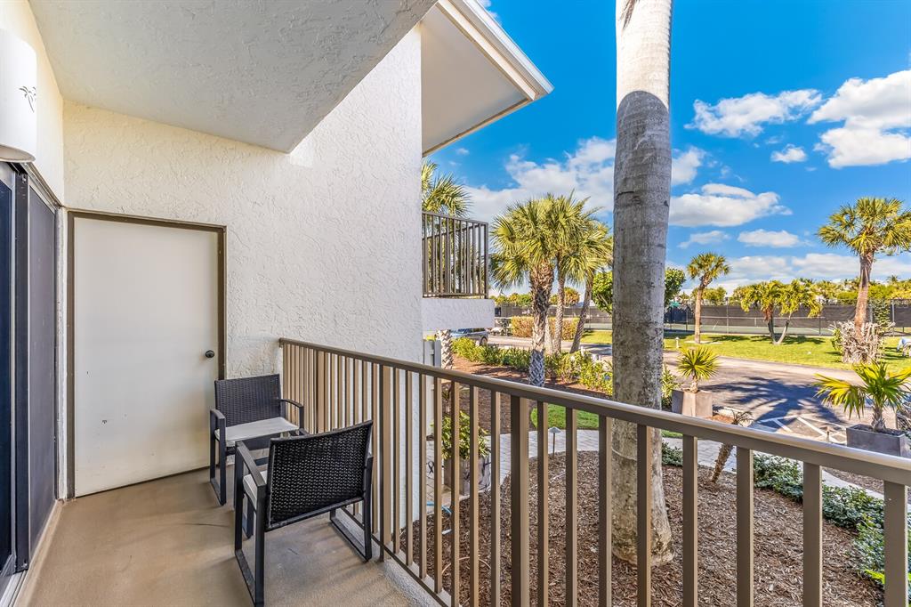 5000 Gasparilla Road, Unit 53A Boca Grande, FL 33921 - Photo 19 of 55 a view of a balcony with chairs