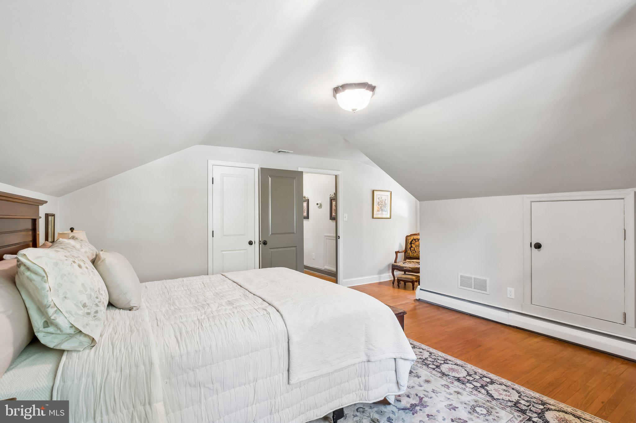 713 Alene Road Ambler, PA 19002 - Photo 26 of 40 a bedroom with a bed and a painting on the wall