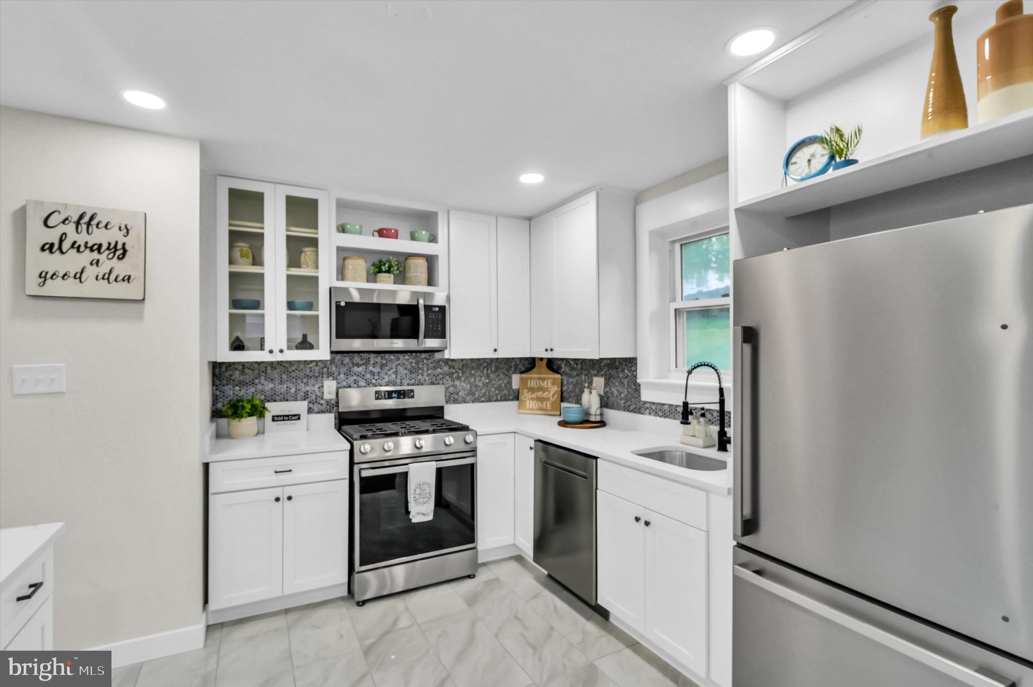 6514 Northam Road Temple Hills, MD 20748 - Photo 20 of 32 Stainless steel appliances, tiled backsplash