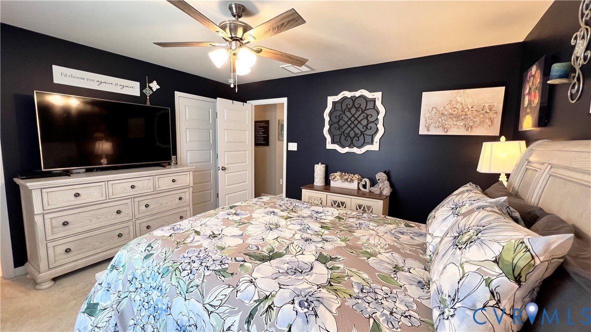 223 Whiteside Road Sandston, VA 23150 - Photo 14 of 20 a bedroom with a bed and a flat screen tv