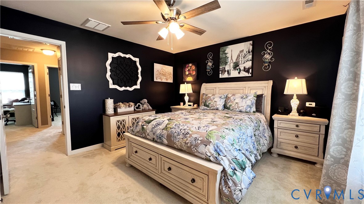 223 Whiteside Road Sandston, VA 23150 - Photo 15 of 20 a bed room with a bed and a chandelier