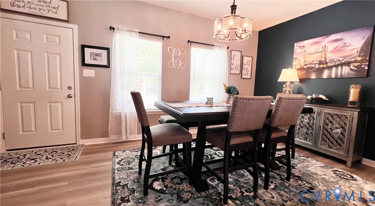 223 Whiteside Road Sandston, VA 23150 - Photo 6 of 20 a view of a dining room with furniture window and wooden floor