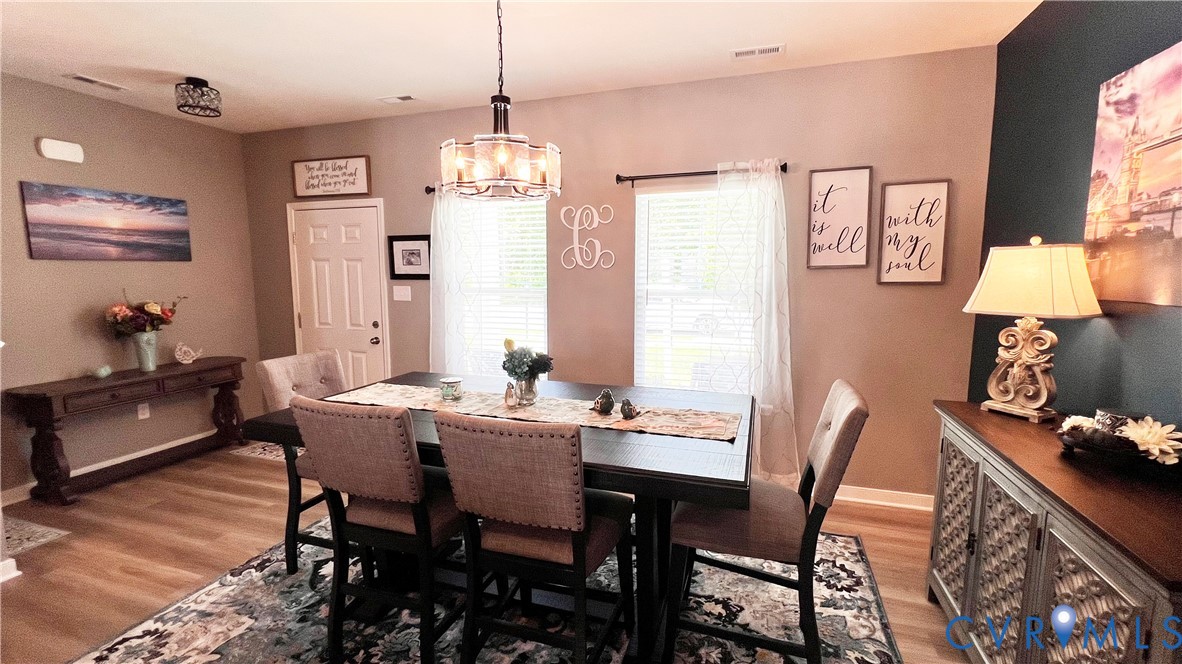 223 Whiteside Road Sandston, VA 23150 - Photo 7 of 20 a view of a dining room with furniture window and wooden floor