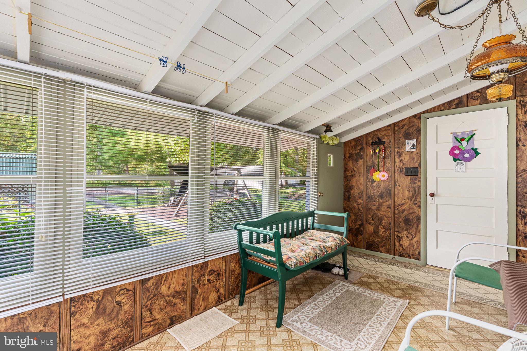 1285 Nursery Road, Unit CABIN 5 Green Lane, PA 18054 - Photo 19 of 34 a balcony with furniture and a large window