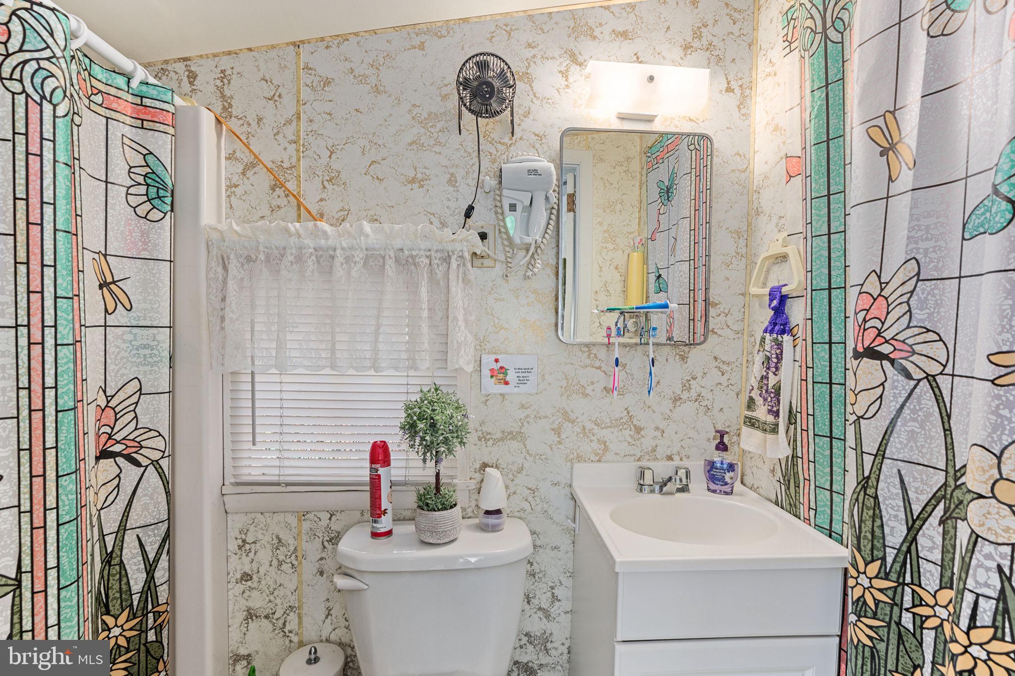 1285 Nursery Road, Unit CABIN 5 Green Lane, PA 18054 - Photo 21 of 34 a bathroom with a sink toilet and shower