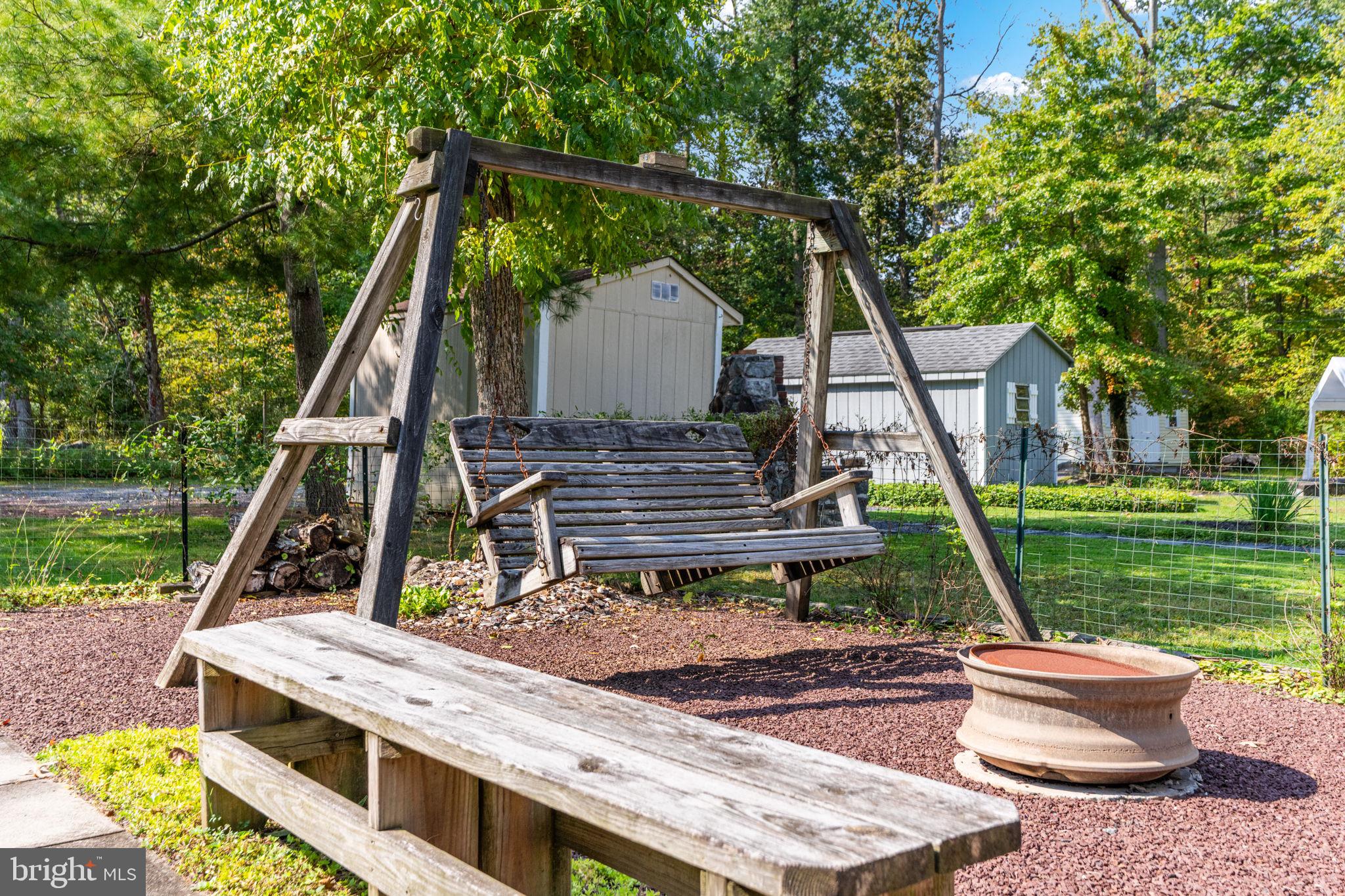 1285 Nursery Road, Unit CABIN 5 Green Lane, PA 18054 - Photo 23 of 34 a view of a deck with a table and chairs