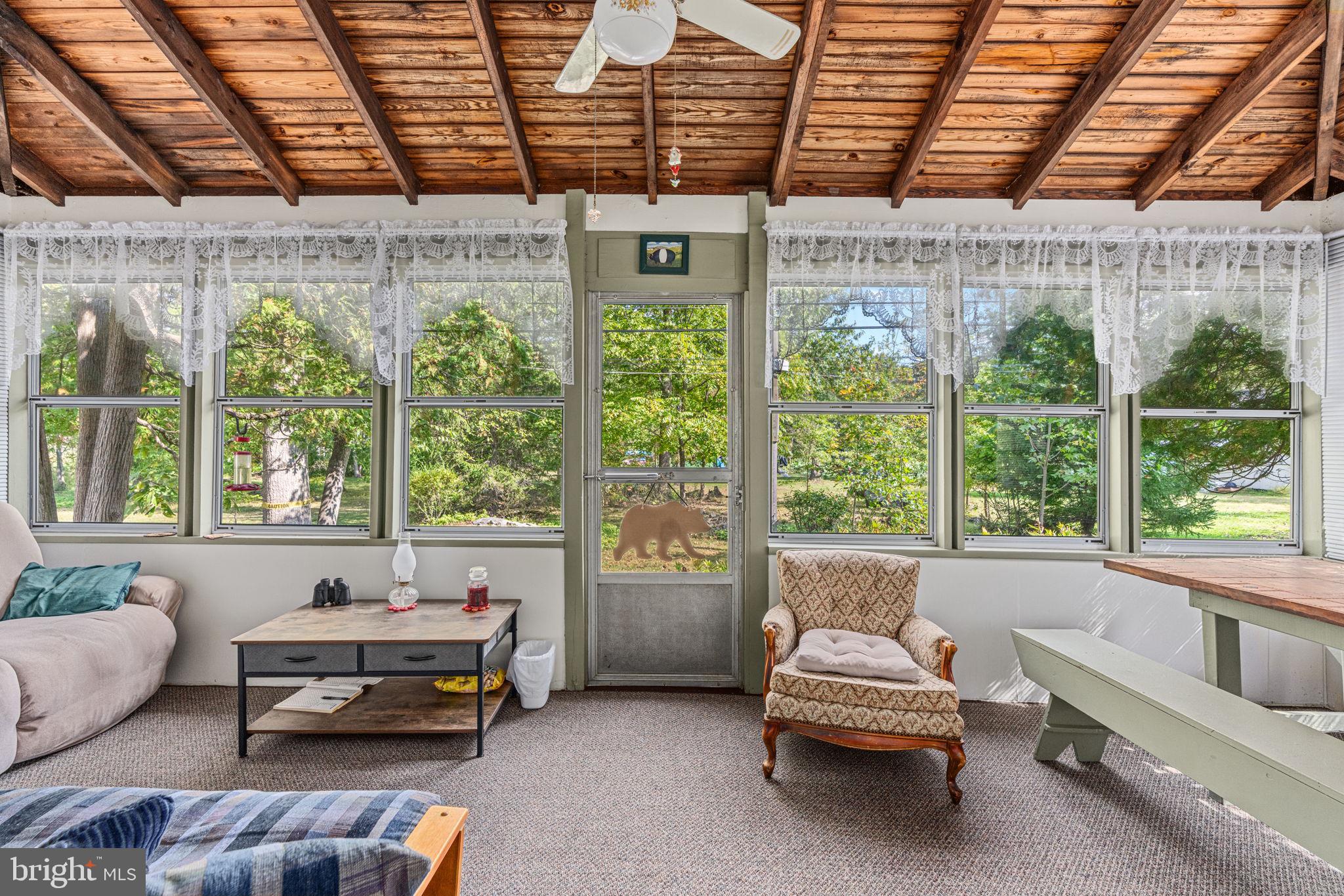 1285 Nursery Road, Unit CABIN 5 Green Lane, PA 18054 - Photo 5 of 34 a living room with furniture and a large window