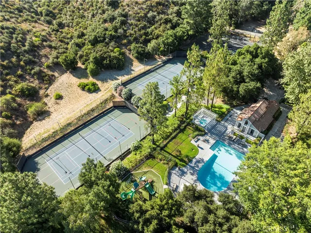 an aerial view of a house with a yard
