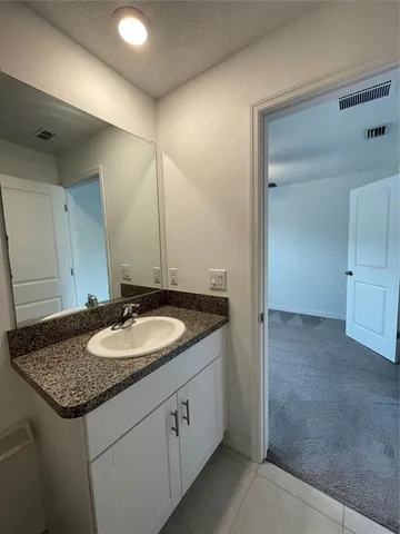 a view of a livingroom with a ceiling fan and window