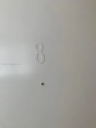 a view of a door and white shower