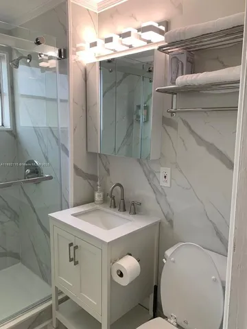 a bathroom with a shower and a tub