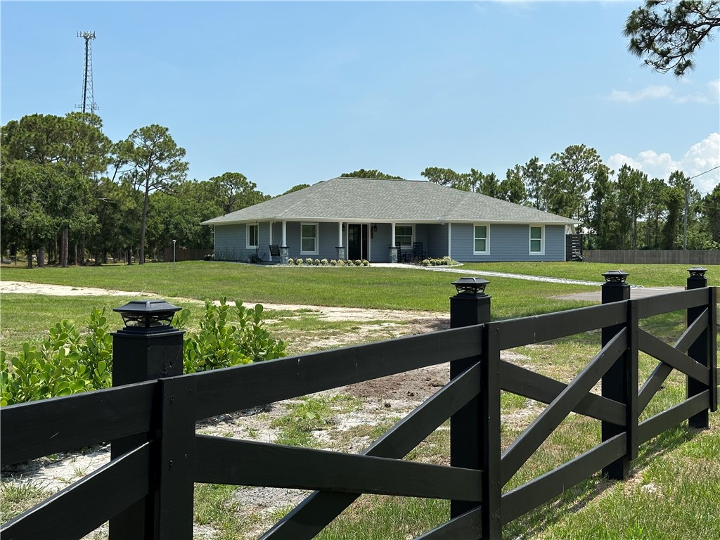 a view of a swimming pool with a garden and outdoor seating