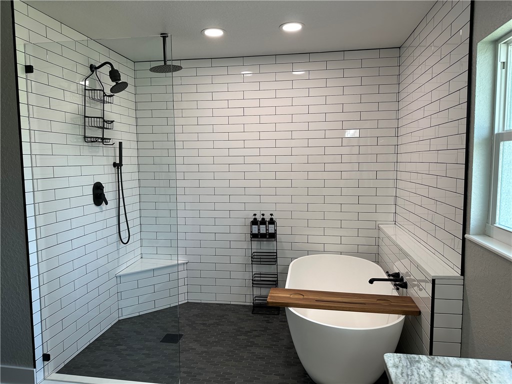 4135 Grant Road Grant Valkaria, FL 32949 - Photo 11 of 26 a bathroom with a toilet and shower