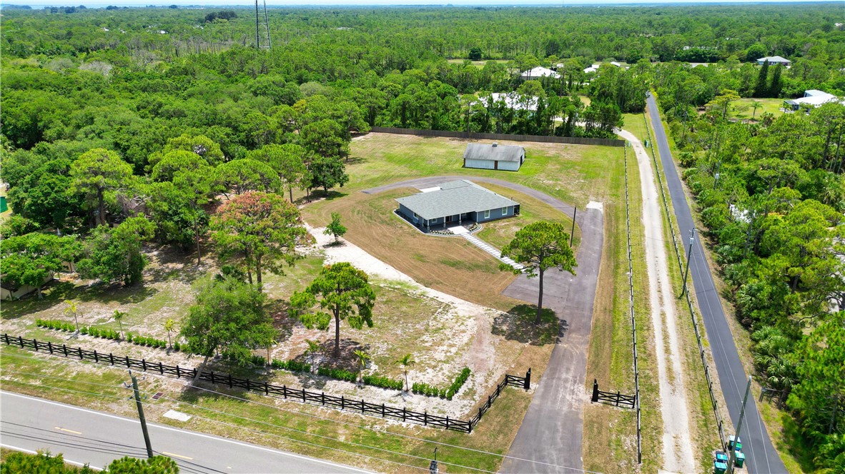 4135 Grant Road Grant Valkaria, FL 32949 - Photo 2 of 26 an aerial view of residential houses with outdoor space