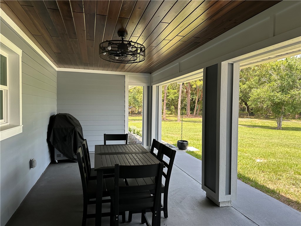 4135 Grant Road Grant Valkaria, FL 32949 - Photo 21 of 26 a dining room with furniture and window
