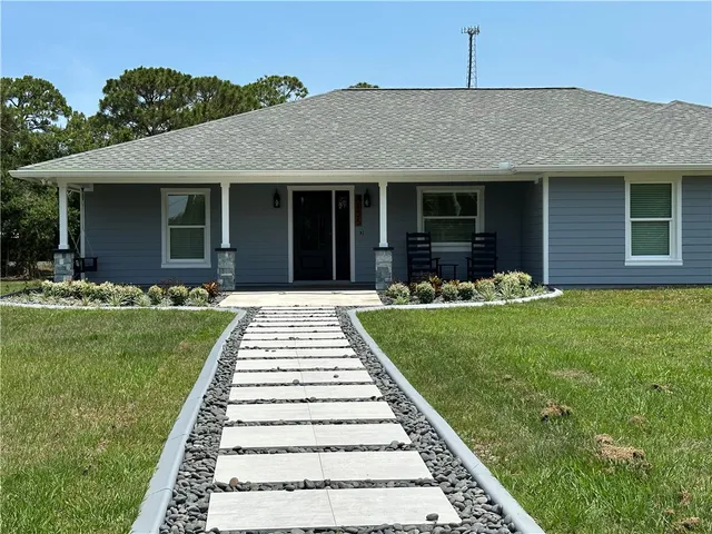 a kitchen with stainless steel appliances a stove refrigerator sink and microwave