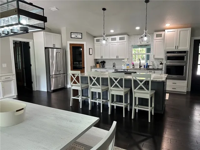 a bathroom with a double vanity sink and mirror