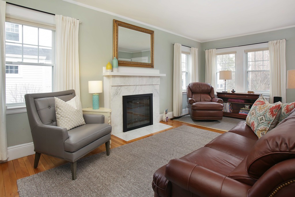 64 Martin Road Wellesley, MA 02481 - Photo 2 of 13 a living room with furniture and a fireplace