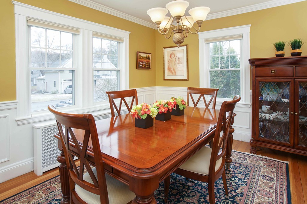 64 Martin Road Wellesley, MA 02481 - Photo 4 of 13 a dining room with furniture a chandelier and wooden floor