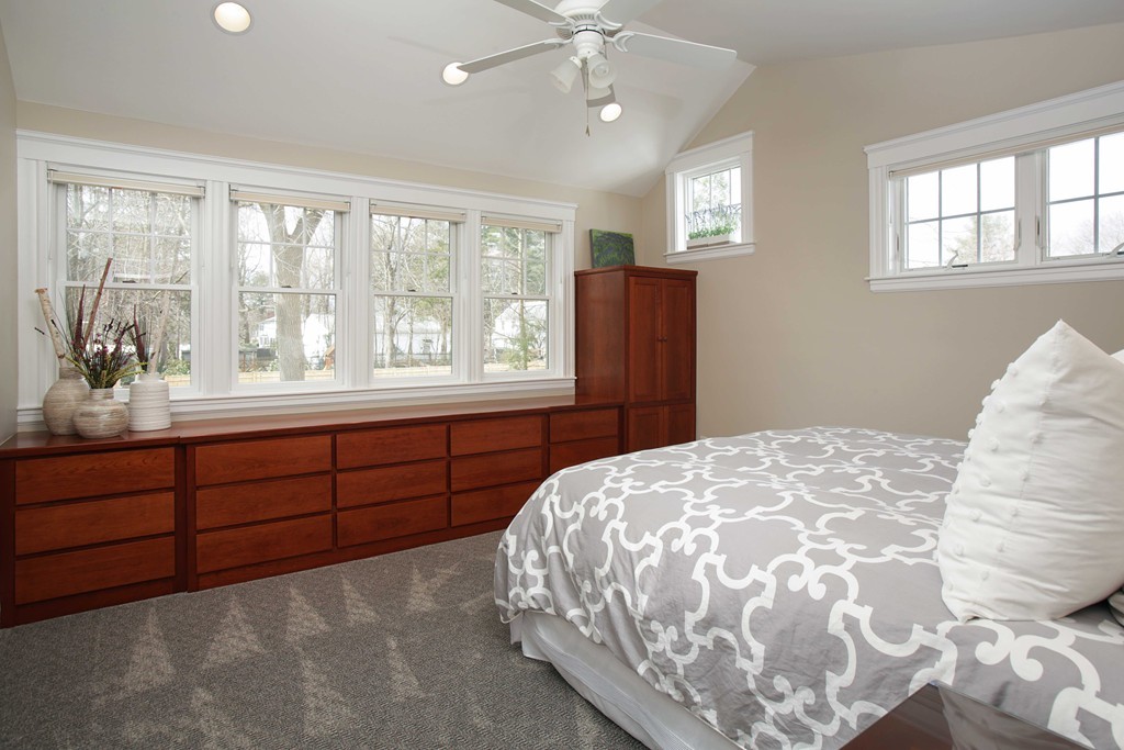 64 Martin Road Wellesley, MA 02481 - Photo 7 of 13 a bedroom with a bed and a dresser