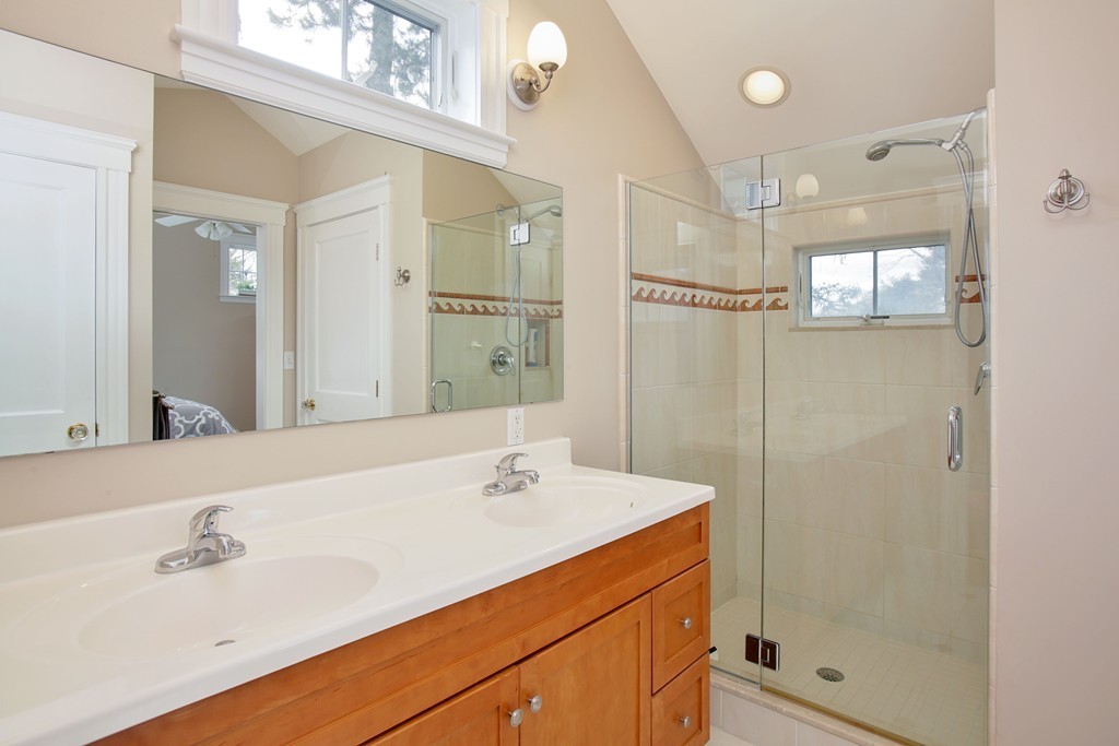 64 Martin Road Wellesley, MA 02481 - Photo 8 of 13 a bathroom with a shower sink and mirror