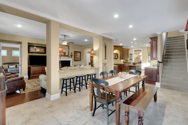 a large kitchen with a table and chairs