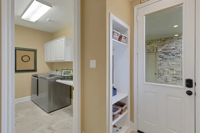 a kitchen with stainless steel appliances granite countertop a sink and a cabinets
