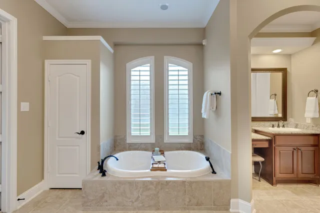 a bathroom with a shower and a sink