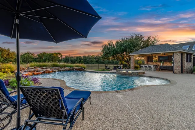 a view of a swimming pool with a patio