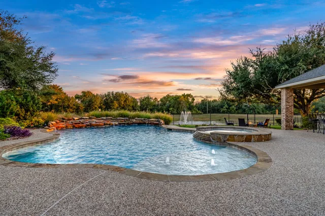 a view of a swimming pool with a lounge chair
