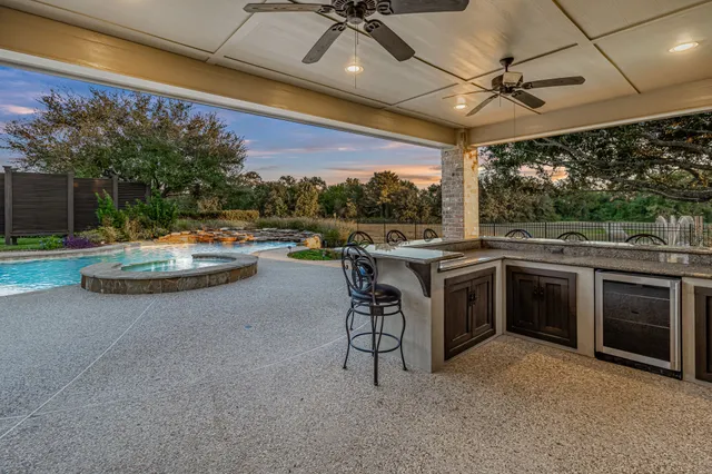 a open kitchen with a stove and a white cabinets