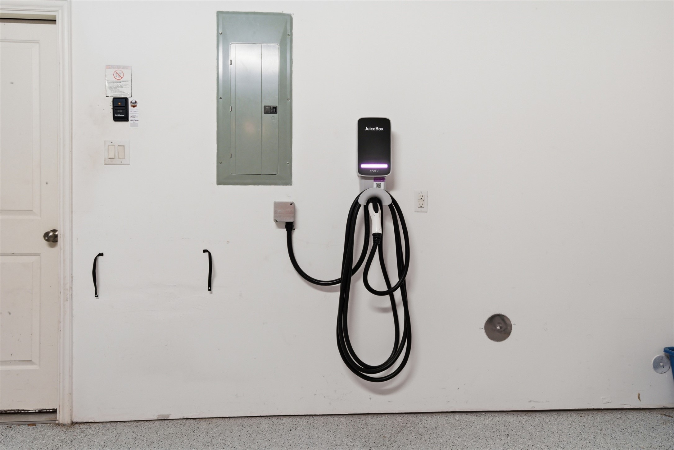 706 Water Street Webster, TX 77598 - Photo 19 of 23 Attached 2-car garage equipped with EV charger and epoxy flooring