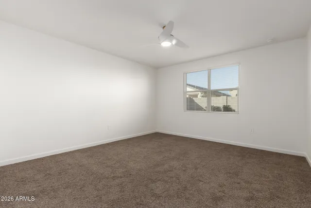 an empty room with a empty space and windows