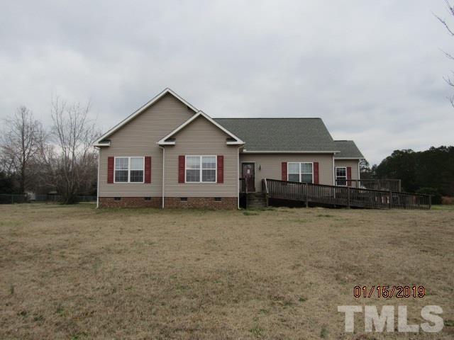 a front view of a house with yard