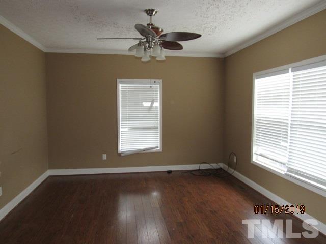 4925 Watkins Road Wendell, NC 27591 - Photo 2 of 10 wooden floor in an empty room with a window