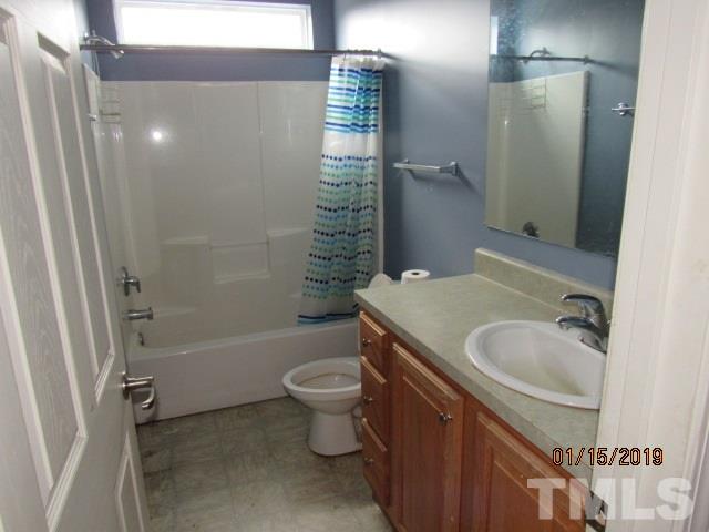 4925 Watkins Road Wendell, NC 27591 - Photo 6 of 10 a bathroom with a sink toilet and shower