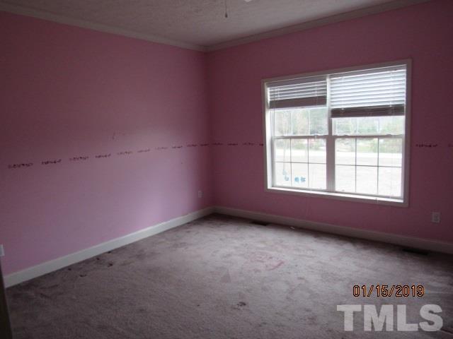4925 Watkins Road Wendell, NC 27591 - Photo 8 of 10 an empty room with a window