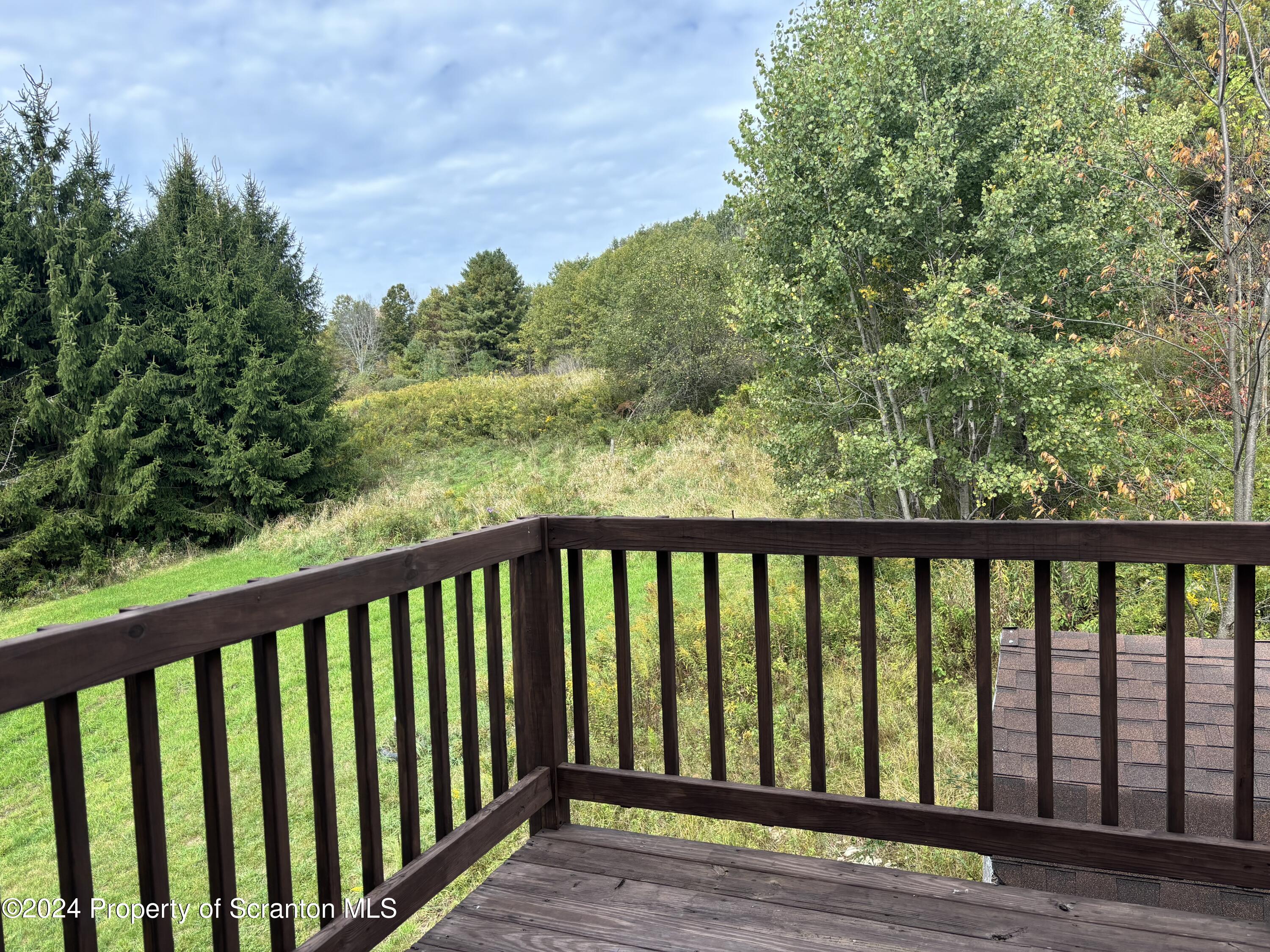 2053 Silver Creek Road Montrose, PA 18801 - Photo 6 of 10 a balcony with wooden floor and fence