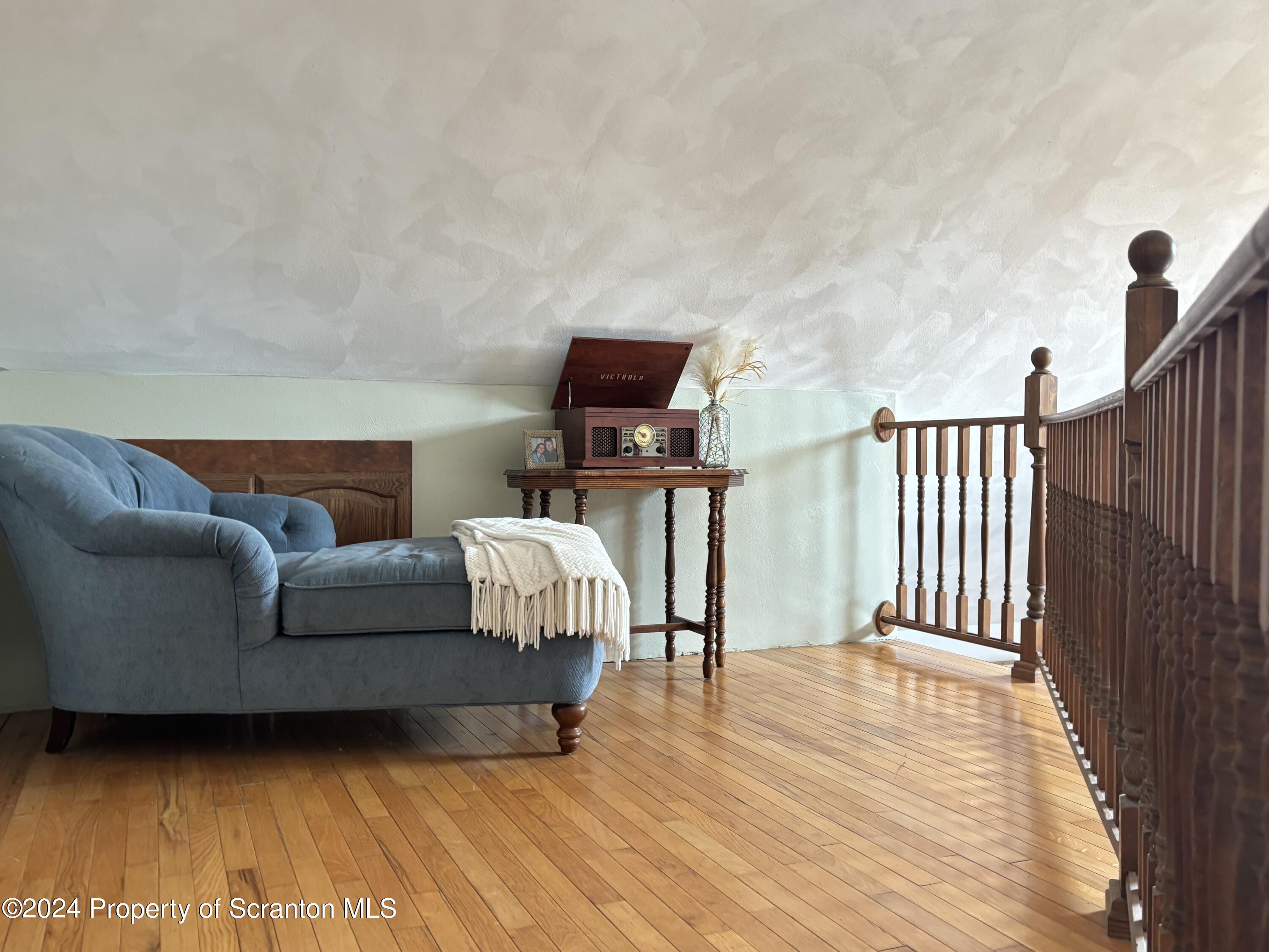 2053 Silver Creek Road Montrose, PA 18801 - Photo 7 of 10 a living room with furniture and a wooden floor