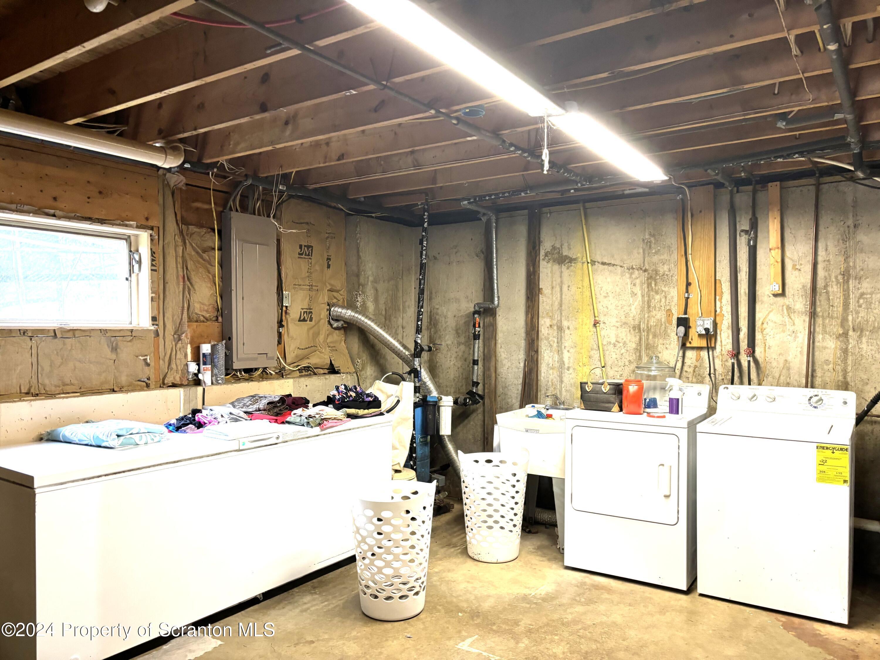 2053 Silver Creek Road Montrose, PA 18801 - Photo 8 of 10 a room with sink washer and dryer