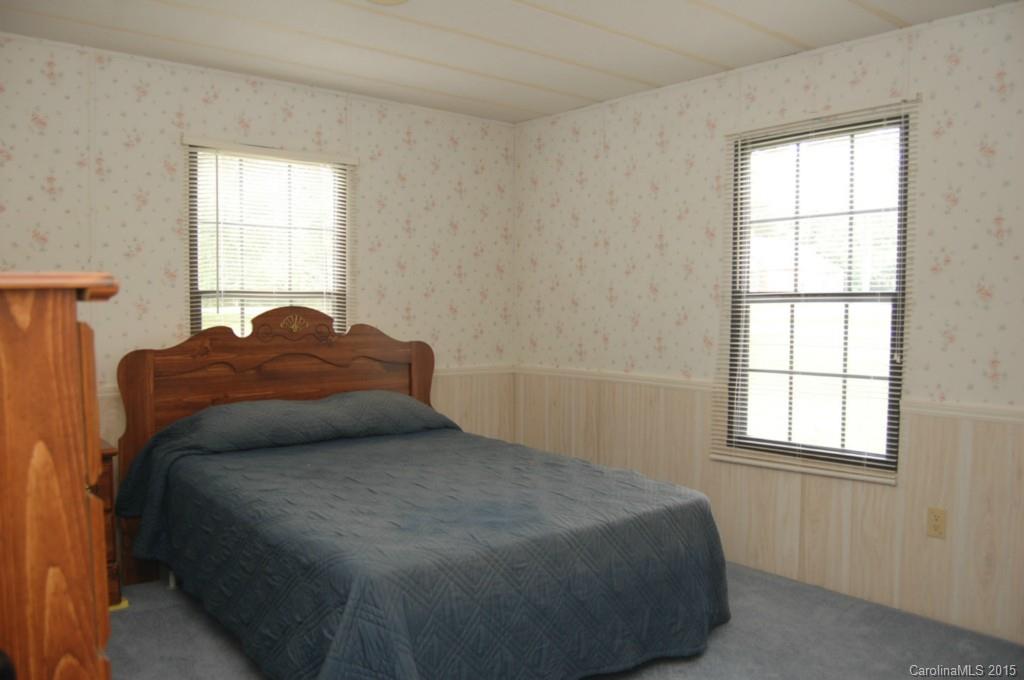 1635 West Ridge Road Salisbury, NC 28147 - Photo 11 of 11 a bed sitting in a bedroom next to a window