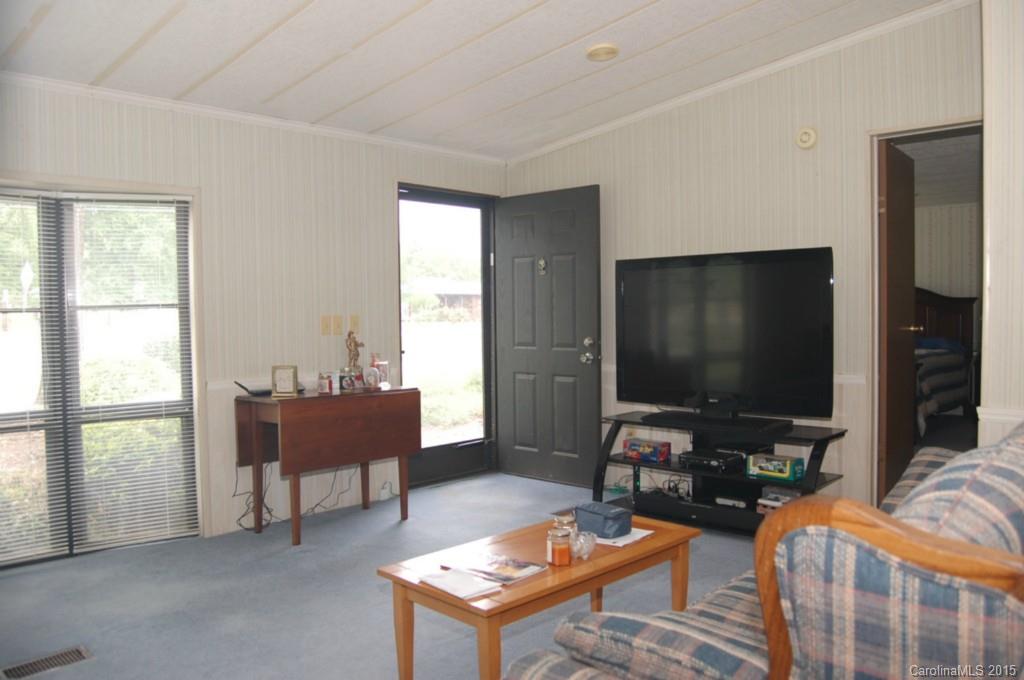 1635 West Ridge Road Salisbury, NC 28147 - Photo 5 of 11 a living room with furniture and a flat screen tv