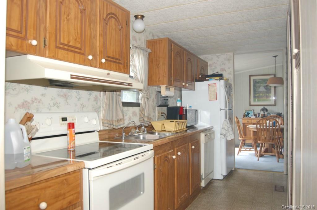 1635 West Ridge Road Salisbury, NC 28147 - Photo 7 of 11 a kitchen with refrigerator and cabinets