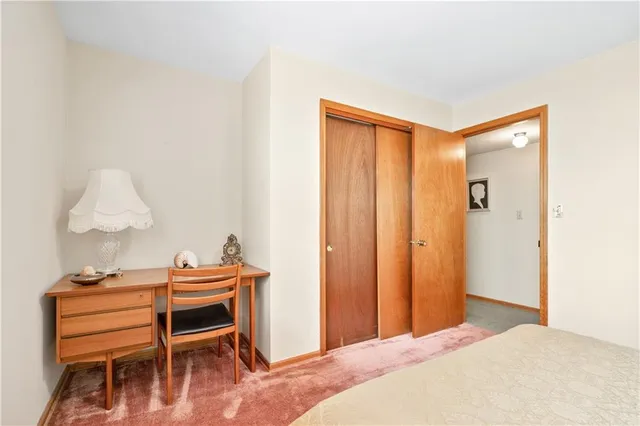 a view of a livingroom with a fireplace and window