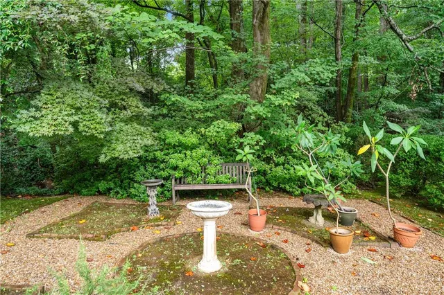 a view of a backyard with sitting area