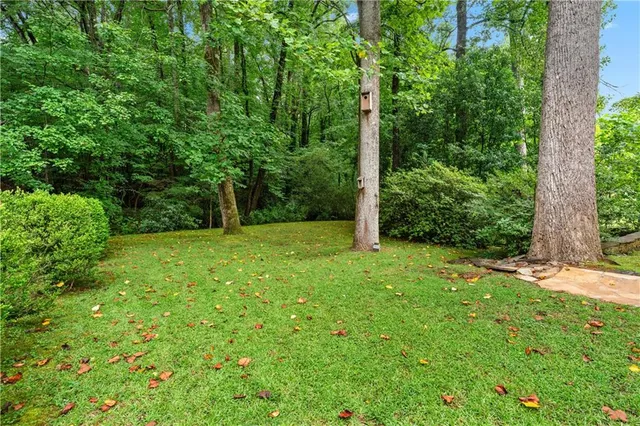 a view of a house with swimming pool and sitting area