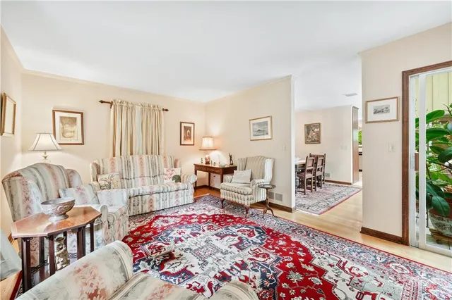 a living room with furniture rug and window