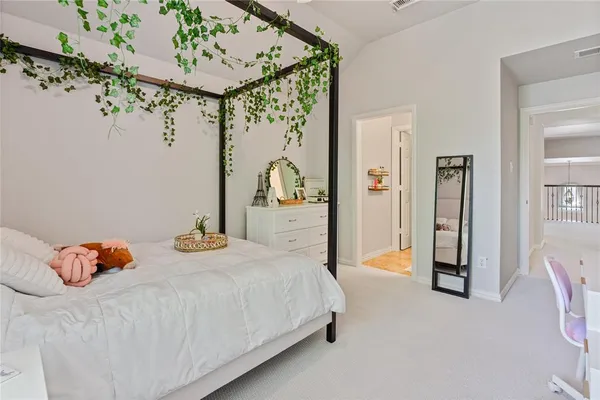 a bedroom with bed and window