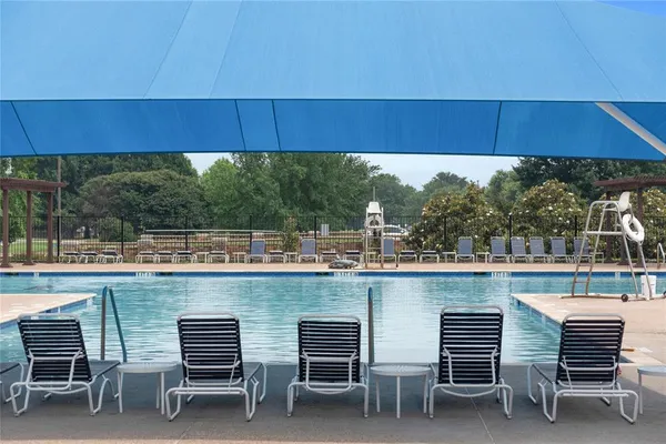 a view of a chairs and table in the patio